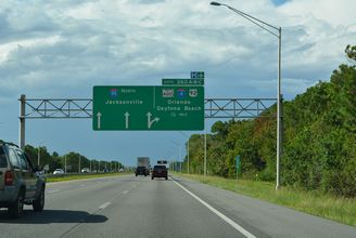 I-95 northbound continues with three lanes beyond the c/d roadway for I-4, US 92 and SR 400.