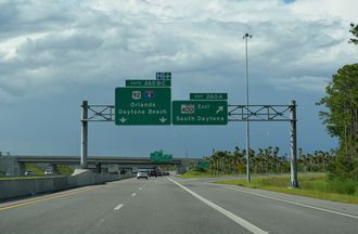 Exit 260 A departs I-95 north for SR 400 extending east from the end of I-4 to South Daytona, Florida.