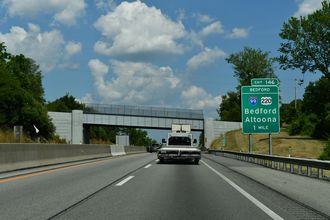 I-70/76 (PA Turnpike) west at Briar Valley Rd, one mile from US 220 Business