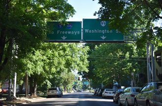 Washington St north meets OR 99/126 Business ahead of I-105/OR 126
