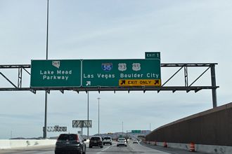 Two lanes extend east from I-215 onto SR 564 (Lake Mead Parkway)