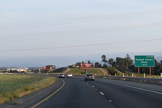 I-215 south ends at I-15 ahead of French Valley Parkway in Murietta, CA.