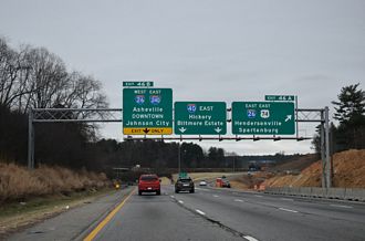 Replaced 2 photos of the west end from I-40 eastbound taken 12/18/25 where initial construction is underway for the Asheville I-26 Connector.
