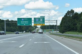 I-85 splits with US 29/52/70 at I-285 north in Lexington, North Carolina.