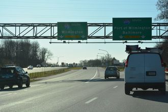 I-95 continues south into Wilmington, DE while I-495 bypasses the city to the east.