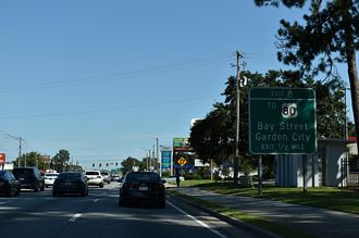 The first exit for I-516 east departs in a half mile.