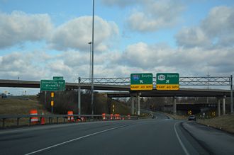 NY 590 spurs north to Sea Breeze Drive while I-590 loops southwest through Brighton to I-390.