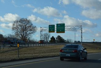 Flyovers depart from NY 590 south to I-490 at the Can of Worms Interchange.