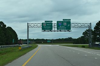Exit 119 A departs I-95 north for I-587 east and I-795 south