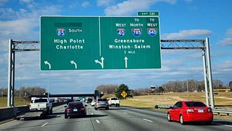 I-40/85 meet I-785/840 (Greensboro Urban Loop) west in one mile.