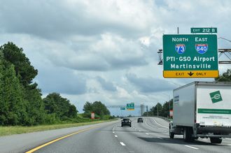 I-40 advances east from US 421 to Exit 212 B for I-73/840 north.
