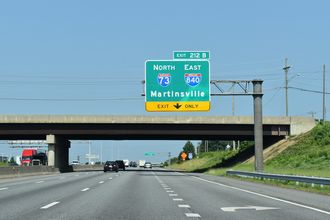 I-40 west at I-73/840 north to PTI Airport.