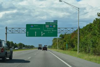 I-95 northbound continues with three lanes beyond the c/d roadway for I-4, US 92 and SR 400.