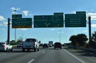 I-95 passes west of Downtown Jacksonville ahead of Exit 352 A for I-10.