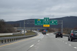 NY 17/U.S. 6 east separate at Exit 130 A in the village of Woodbury.
