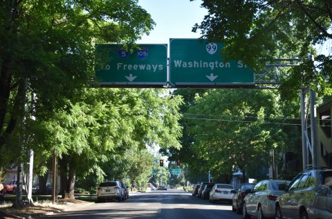 Washington St north meets OR 99/126 Business ahead of I-105/OR 126