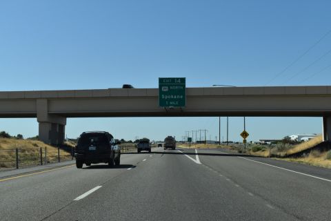 US 12 heads one mile west from E Lewis St combine with US 395