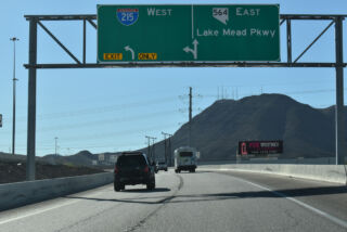 The exit from I-11 south partitions for SR 564 east and I-215 west.