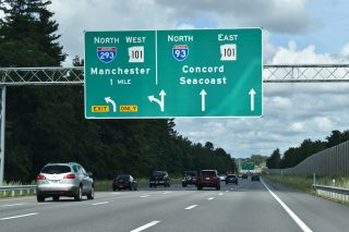 One mile ahead of I-293/NH 101 west on I-93 north in Manchester.