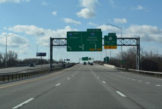 NY 390 south crosses the Erie Canal a half mile ahead of I-390/490.