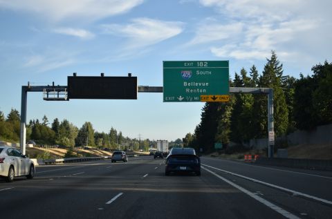 I-5 converges with I-405/SR 525 south at Exit 182 in a half mile
