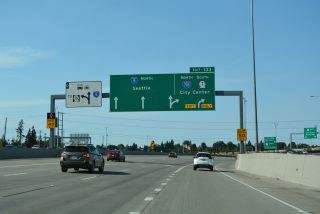 Curving into the three-wye interchange with SR 16, Exit 133 leaves I-5 north