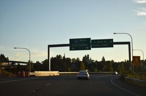 Exit 133 for I-705 north also links with E 26th St to the Tacoma Dome