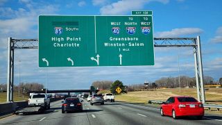 I-40/85 meet I-785/840 (Greensboro Urban Loop) west in one mile.